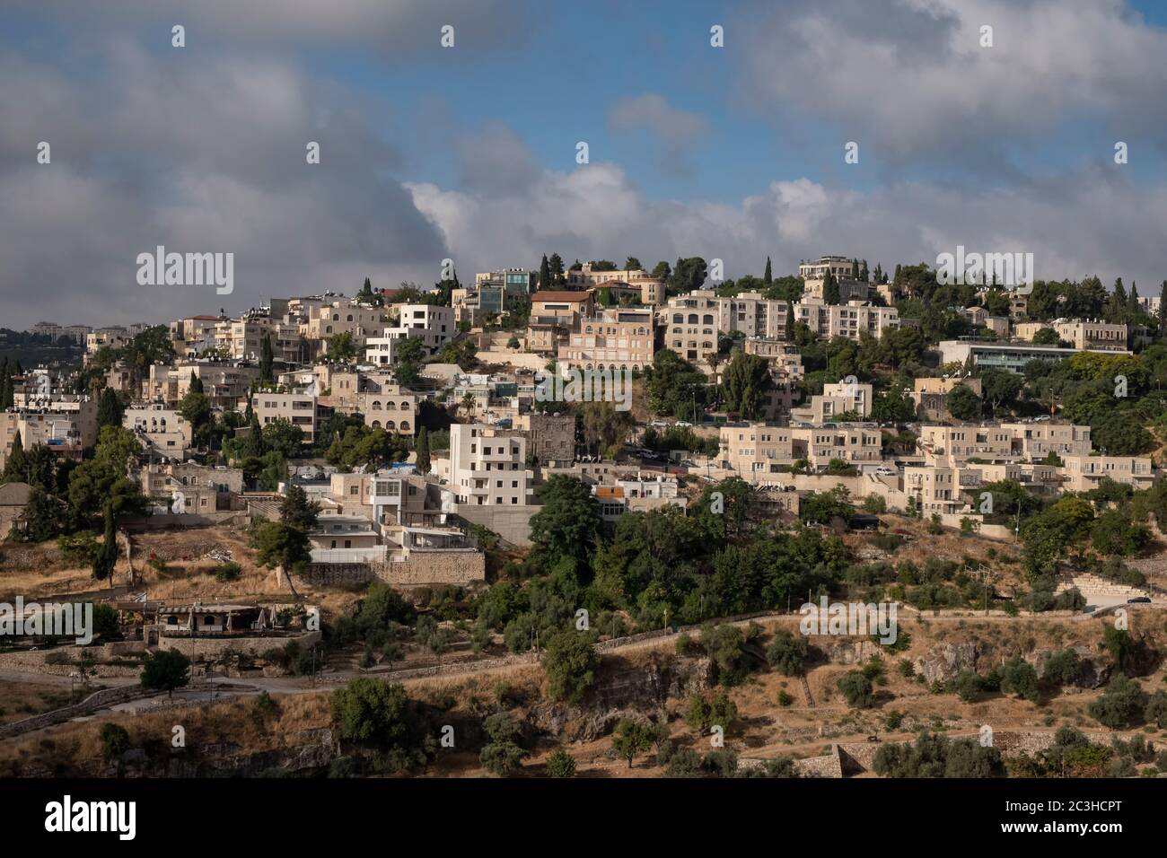 View of Abu Tor a mixed Jewish and Arab neighborhood located over valley of Hinnom the modern name for the biblical Gehenna or Gehinnom valley surrounding Jerusalem's Old City, Israel Stock Photo