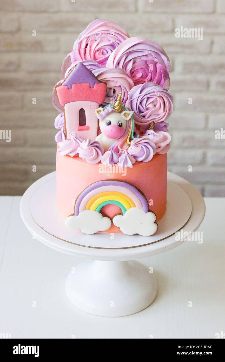Cute pink birthday cake for a little girl with fondant unicorn ...