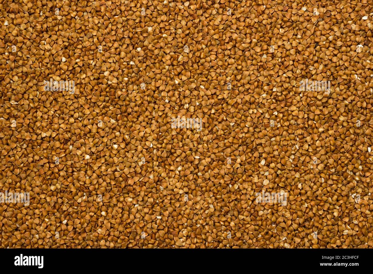 Dry buckwheat grains brown texture, food Stock Photo Alamy