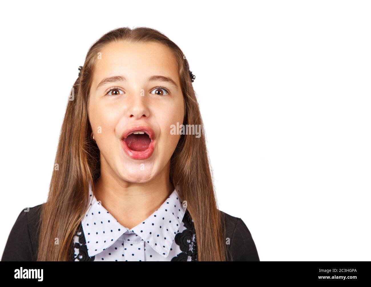 beautiful teen girl making funny faces fooling around on white