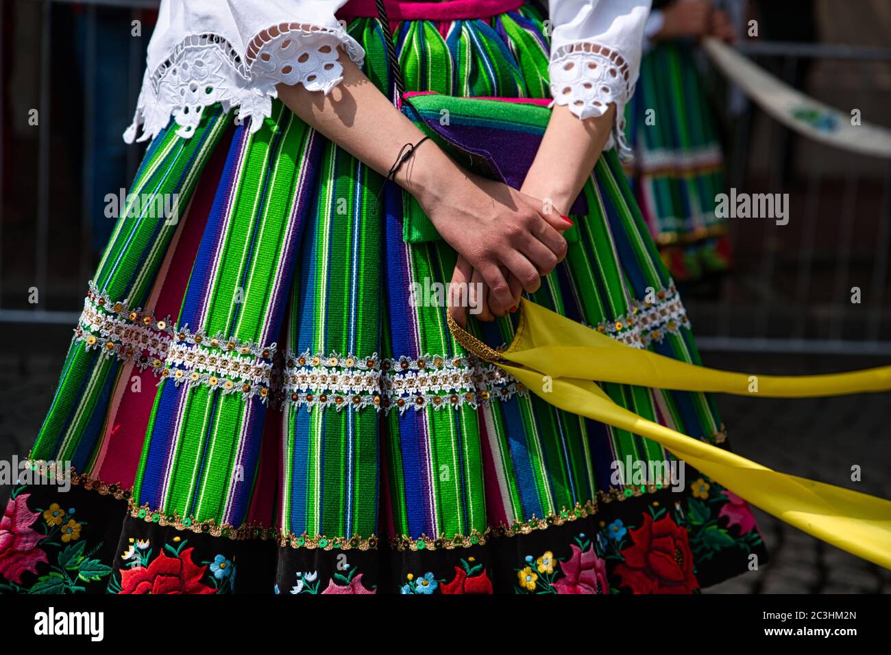 Woman dressed in polish national folk costumes from Lowicz region.  Traditional colorful striped folk dress and floral embroidery Stock Photo -  Alamy