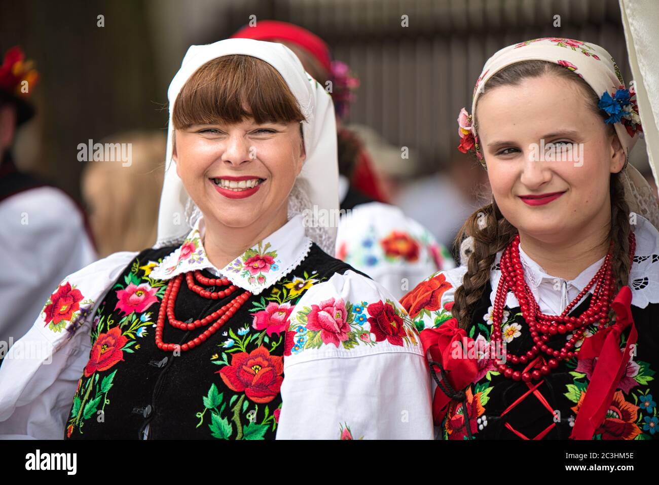 Lowicz, Jun 11, 2020: Portraits of women dressed in polish national folk costumes from Lowicz region. Polish folk dress with floral embroidery Stock Photo