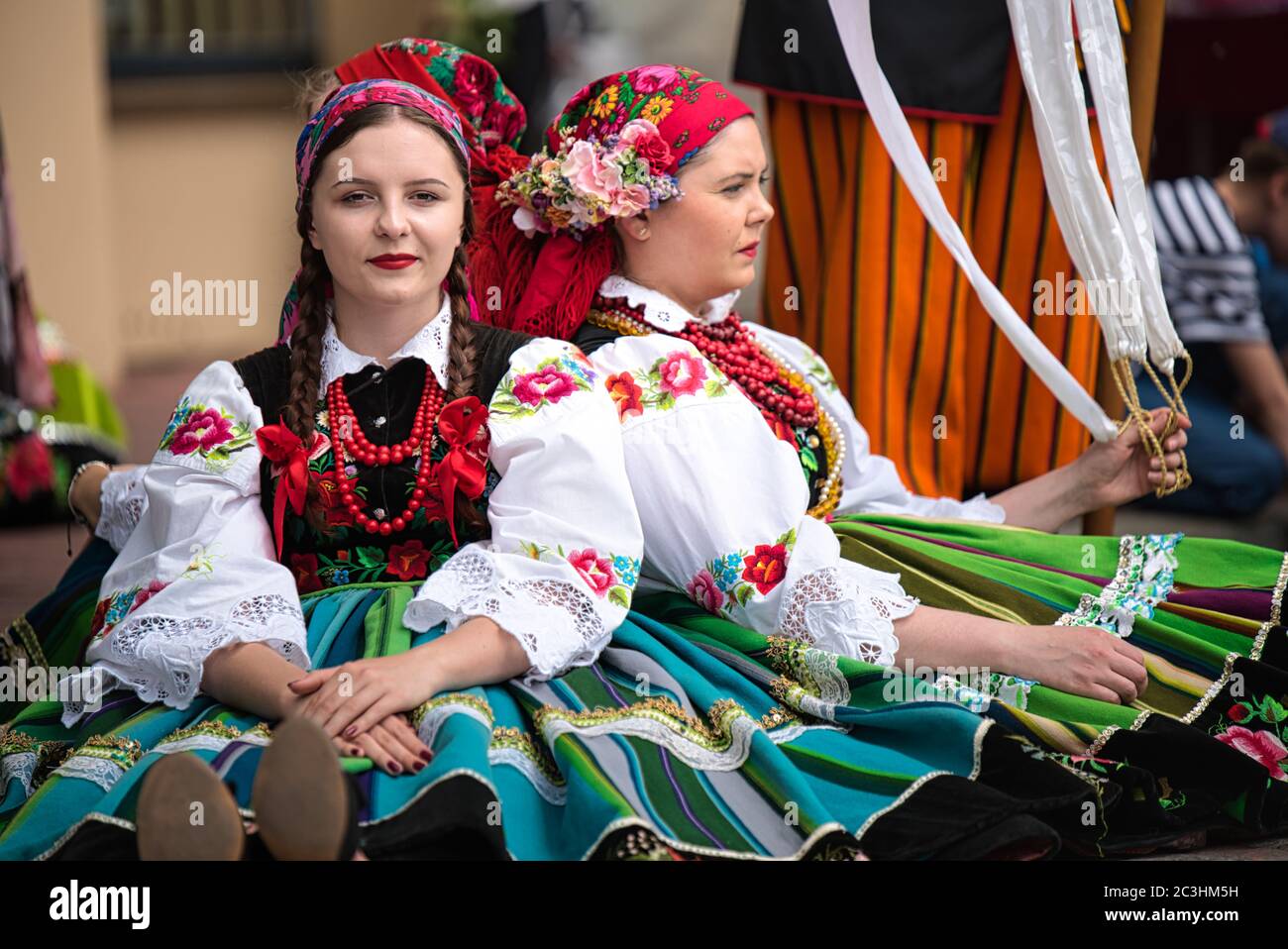 Lowicz, Jun 11, 2020: Girls dressed in polish national folk costumes from Lowicz region during annual Corpus Christi procession. Polish culture Stock Photo