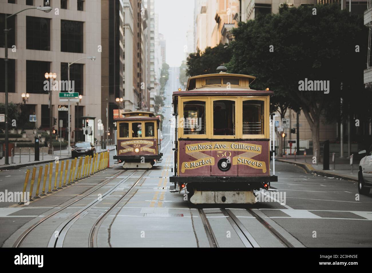 Classic view of traditional historic San Francisco Cable Cars on famous California Street in the early morning with retro vintage toned filter effect Stock Photo