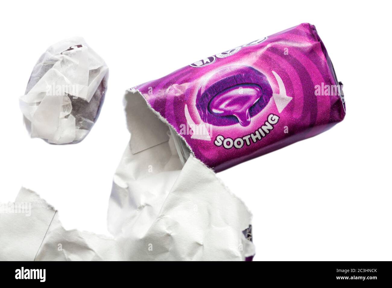 soothing Halls Soothers sweets blackcurrant flavour with sweet removed from packet set on white background Stock Photo