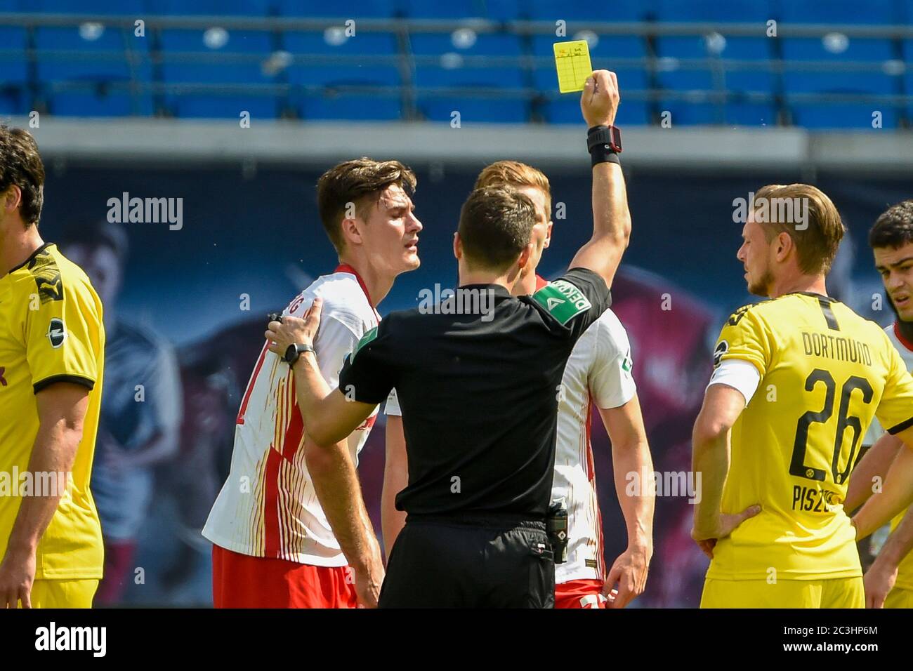 Leipzig, Germany. 20th June, 2020. Football: Bundesliga, 33rd matchday, RB Leipzig - Borussia Dortmund, in the Red Bull Arena. Patrik Schick (2nd from left) from Leipzig gets a yellow card. Credit: Jens Meyer/AP-Pool/dpa - IMPORTANT NOTE: In accordance with the regulations of the DFL Deutsche Fußball Liga and the DFB Deutscher Fußball-Bund, it is prohibited to exploit or have exploited in the stadium and/or from the game taken photographs in the form of sequence images and/or video-like photo series./dpa/Alamy Live News Stock Photo