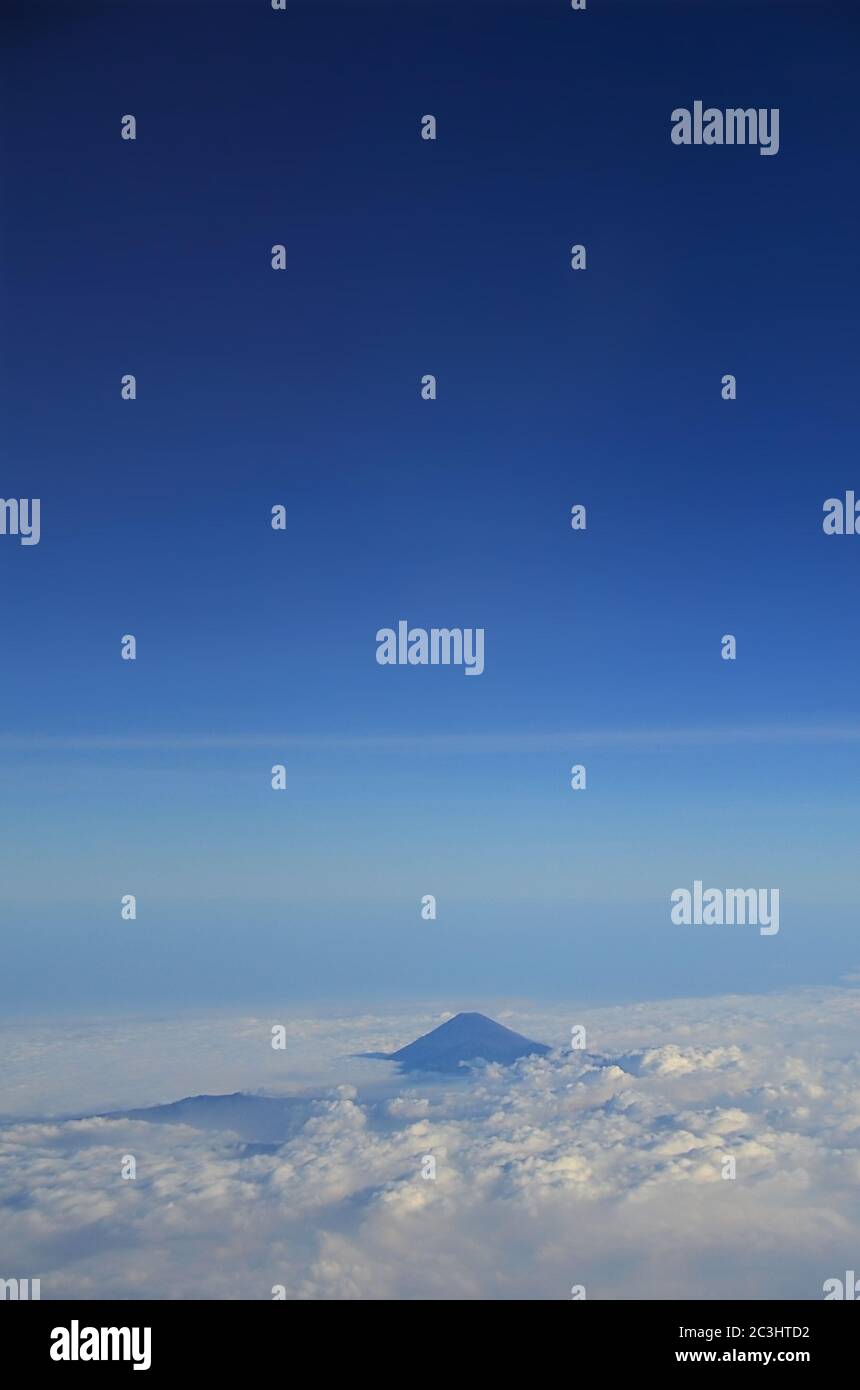 Mount Agung in Bali is an active volcano, Indonesia. View from Aeroplane. Stock Photo
