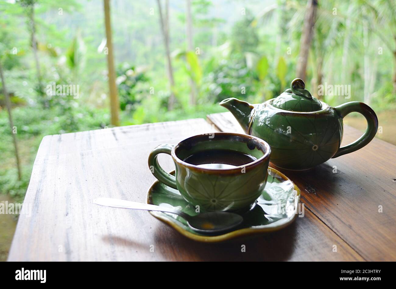 Relaxing afternoon tea of Kopi Lumak. It specialty coffee that is digested by, fermented within, and excreted by the Asian palm civet. Stock Photo