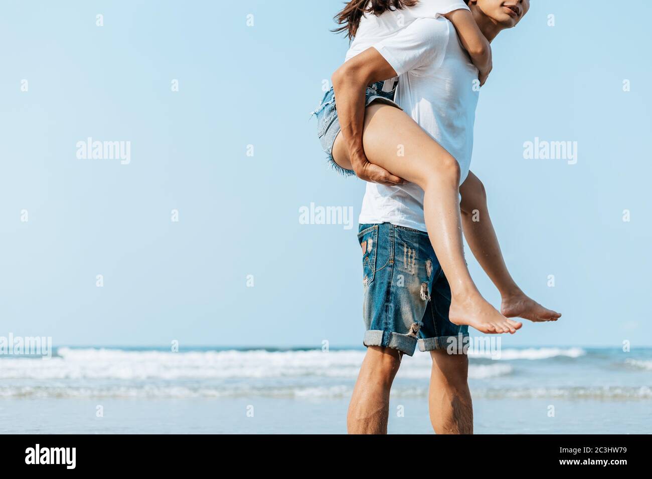 Romantic couple having love and hug on the beach Stock Photo - Alamy