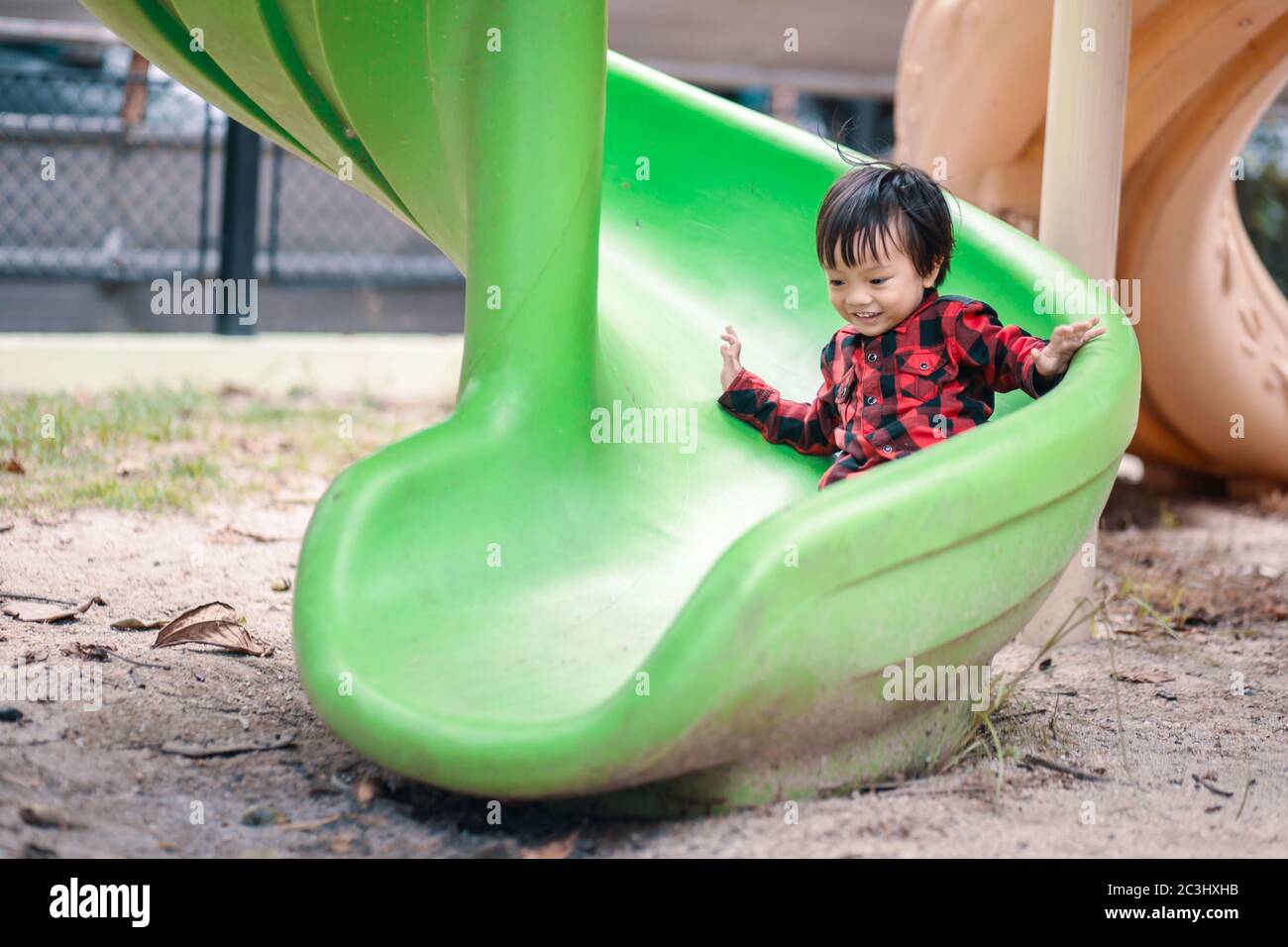 A children play slide playground in the park Stock Photo Alamy