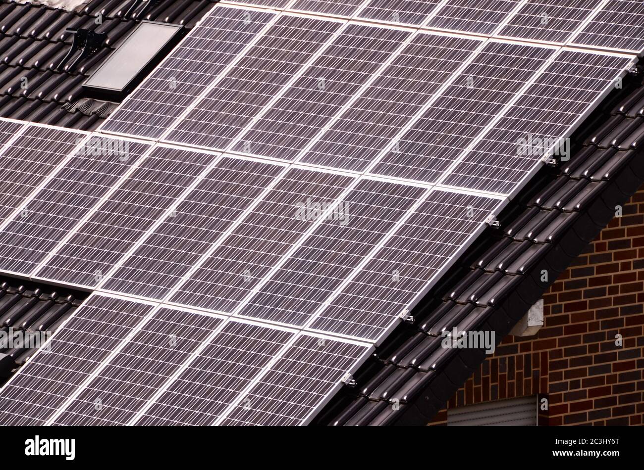 Green Renewable Energy with Photovoltaic Panels on the Roof Stock Photo ...