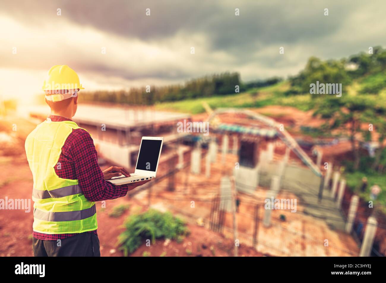Construction Worker Planning use laptop for working and checking site