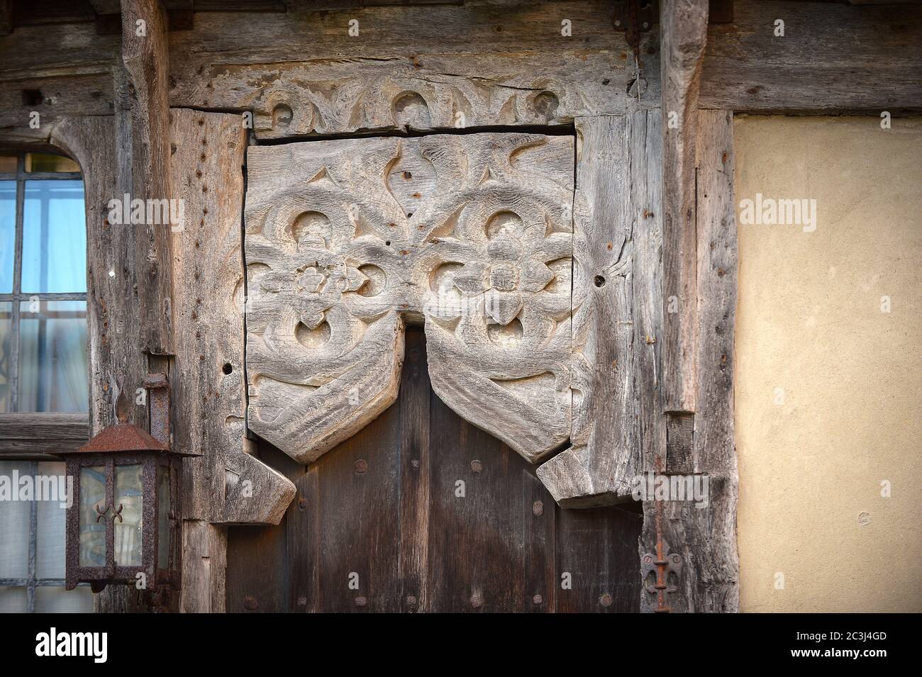 Medieval carved Oak timber door head Stock Photo