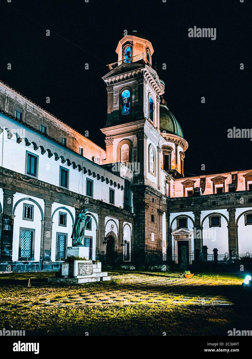 Vertical low angle shot of a historical stone building with a tower on ...