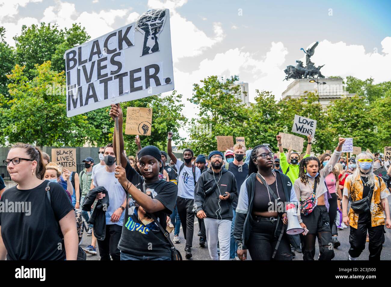 London, UK. 20th June, 2020. They then march to Westmister - Black Lives Matter protesters, gather in Hyde Park again, to respond to the the death of George Floyd, in Minneapolis. The 46-year-old African American was filmed as a white police officer kneeled on his neck for almost nine minutes. The eased 'lockdown' continues for the Coronavirus (Covid 19) outbreak in London. Credit: Guy Bell/Alamy Live News Stock Photo
