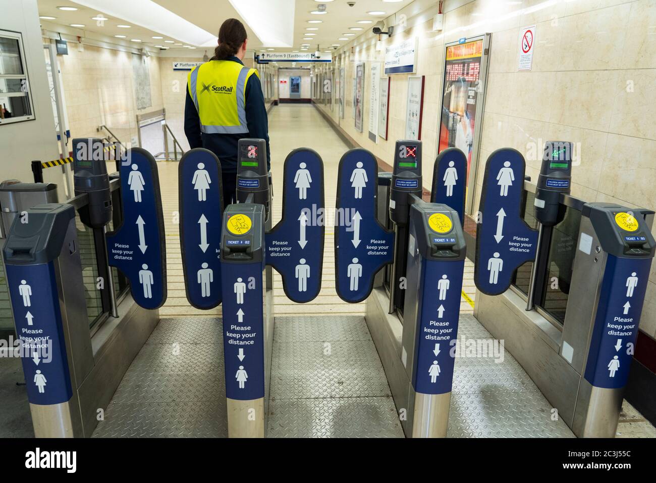 Glasgow, Scotland, UK. 20 June, 2020. Signs with social distance warnings to passengers on entrance barriers to Queen Street railway station in Glasgow.  Iain Masterton/Alamy Live News Stock Photo