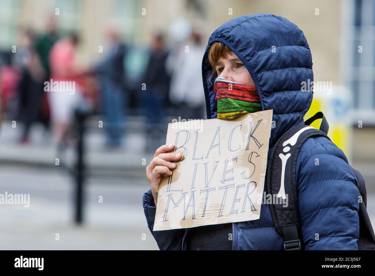Chippenham, Wiltshire, UK. 20th June, 2020. A woman holds up a black lives matter sign during a black lives matter BLM protest in the town's Market Place. The rally was organised in order for local people to draw attention to racism in the UK and to show solidarity with other BLM protests that have been taking place around the world after the death of George Floyd who died in police custody on 25th May in Minneapolis. Credit: Lynchpics/Alamy Live News Stock Photo