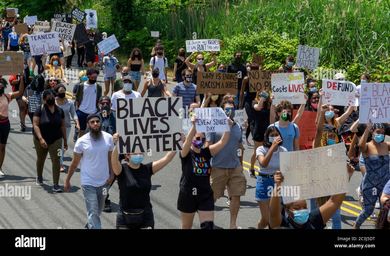 Juneteenth March Black Lives Matter George Floyd Protest - Huge crowd of protesters holding signs blocking street in Teaneck, New Jersey Stock Photo
