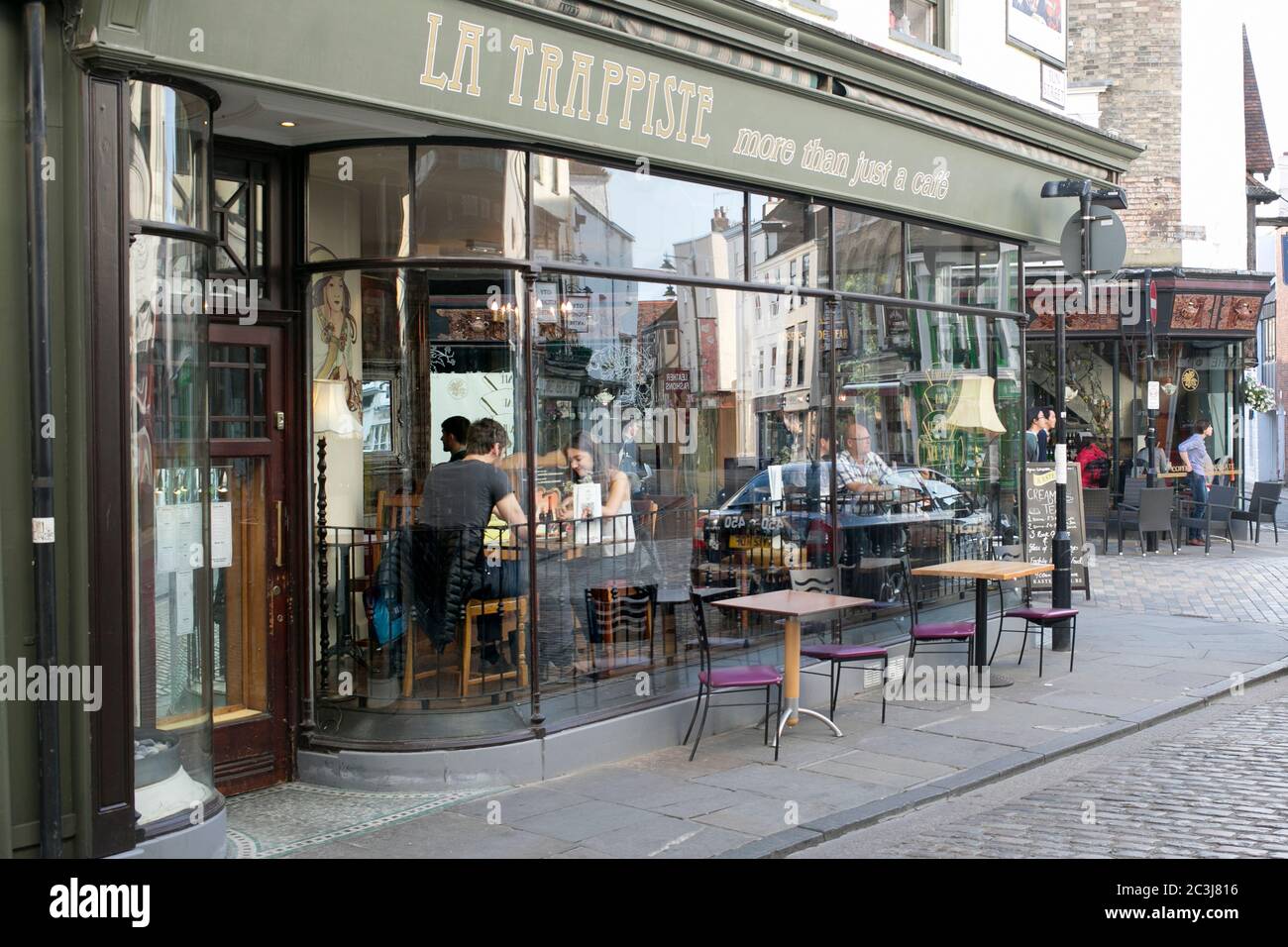 Customers dining outside al fresco at La Trappiste on Sun Street in Canterbury, Kent. Stock Photo