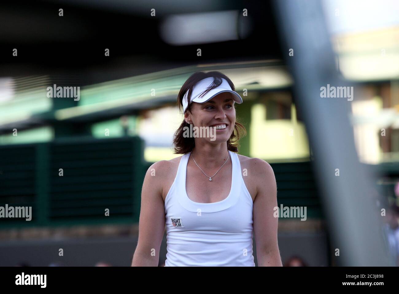 Martina Hingis walks to change sides in between games during the Ladies Invitational Doubles Competition at Wimbledon, 2010 at which she partnered with Anna Kournikouva. Stock Photo