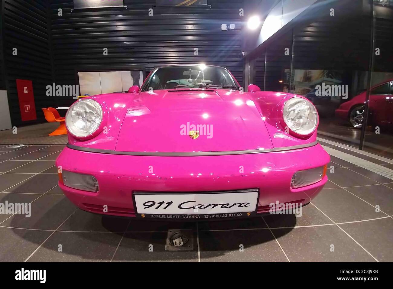 Moscow. February 2019. Front view, headlights and a hood of Porsche 930.  Classic collectible Pink Porsche 911 carrera RS in showroow of dealer  center Stock Photo - Alamy