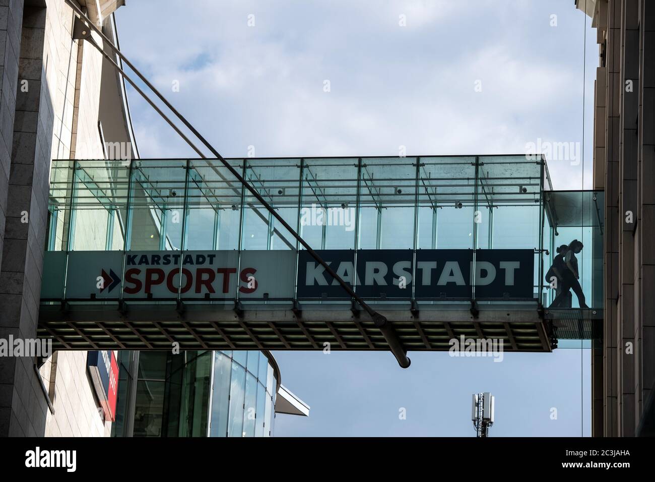 Dortmund, Germany. 20th June, 2020. Two women walk across a glass bridge, which is a branch of Karstadt and Karstadt Sports. In addition to the planned closure of dozens of branches of the department store chain Galeria Karstadt Kaufhof, 20 of the 30 branches of the Karstadt Sports subsidiary are also to be closed. Credit: Bernd Thissen/dpa/Alamy Live News Stock Photo