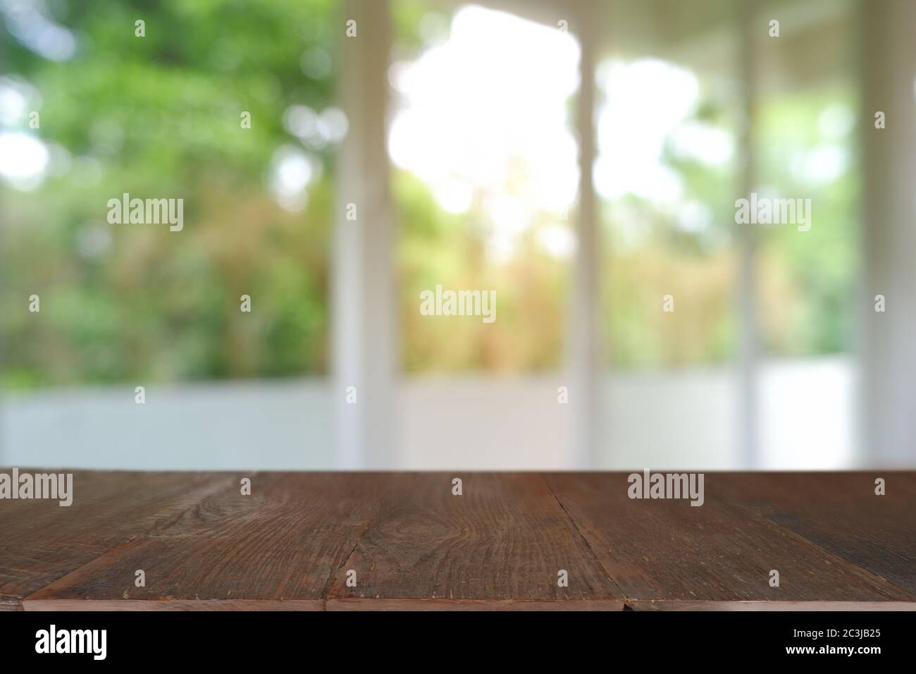 Empty wooden table in front of abstract blurred Cafe, restaurant. For ...