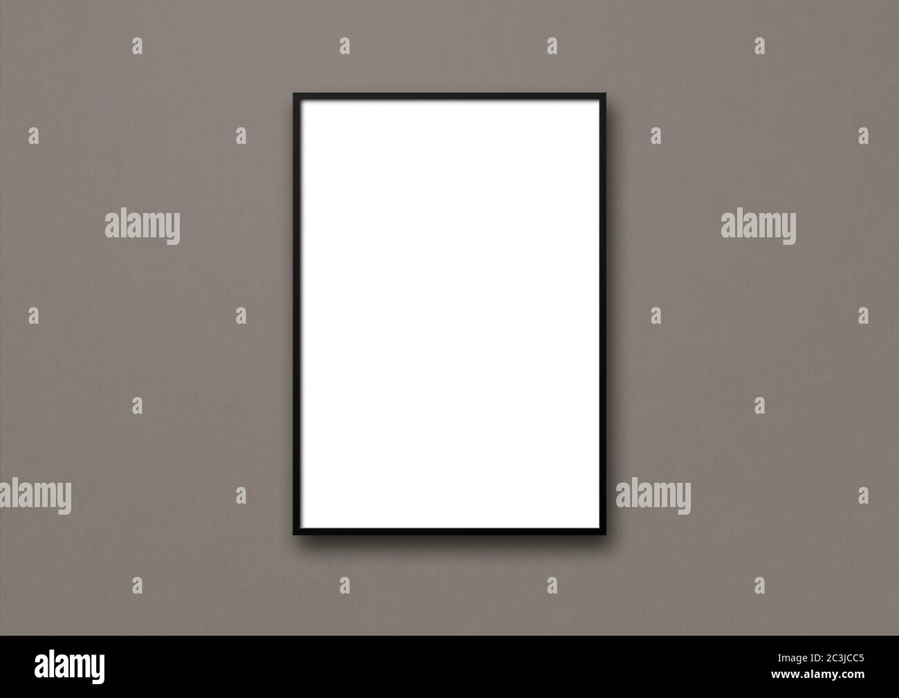 Black picture frame hanging on a dark grey wall. Blank mockup template ...