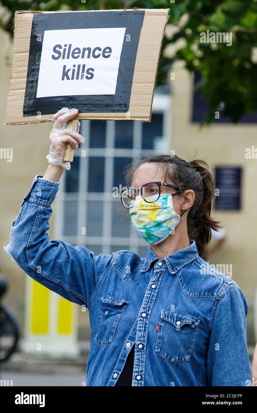Chippenham, Wiltshire, UK. 20th June, 2020. A woman holds up a placard at a black lives matter BLM protest in the town's Market Place. The rally was organised in order for local people to draw attention to racism in the UK and to show solidarity with other BLM protests that have been taking place around the world after the death of George Floyd who died in police custody on 25th May in Minneapolis. Credit: Lynchpics/Alamy Live News Stock Photo