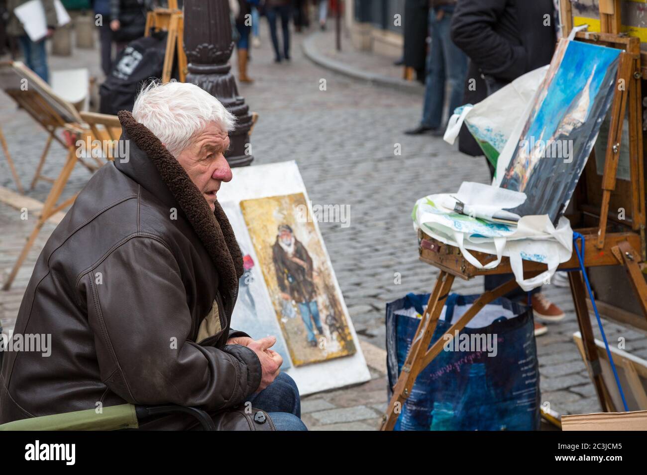 PARIS, FRANCE - MARCH 3RD: Street artists display their work in a cobbled market square in Montmartre, 18th Arrondissement. On March 3rd 2015 Stock Photo