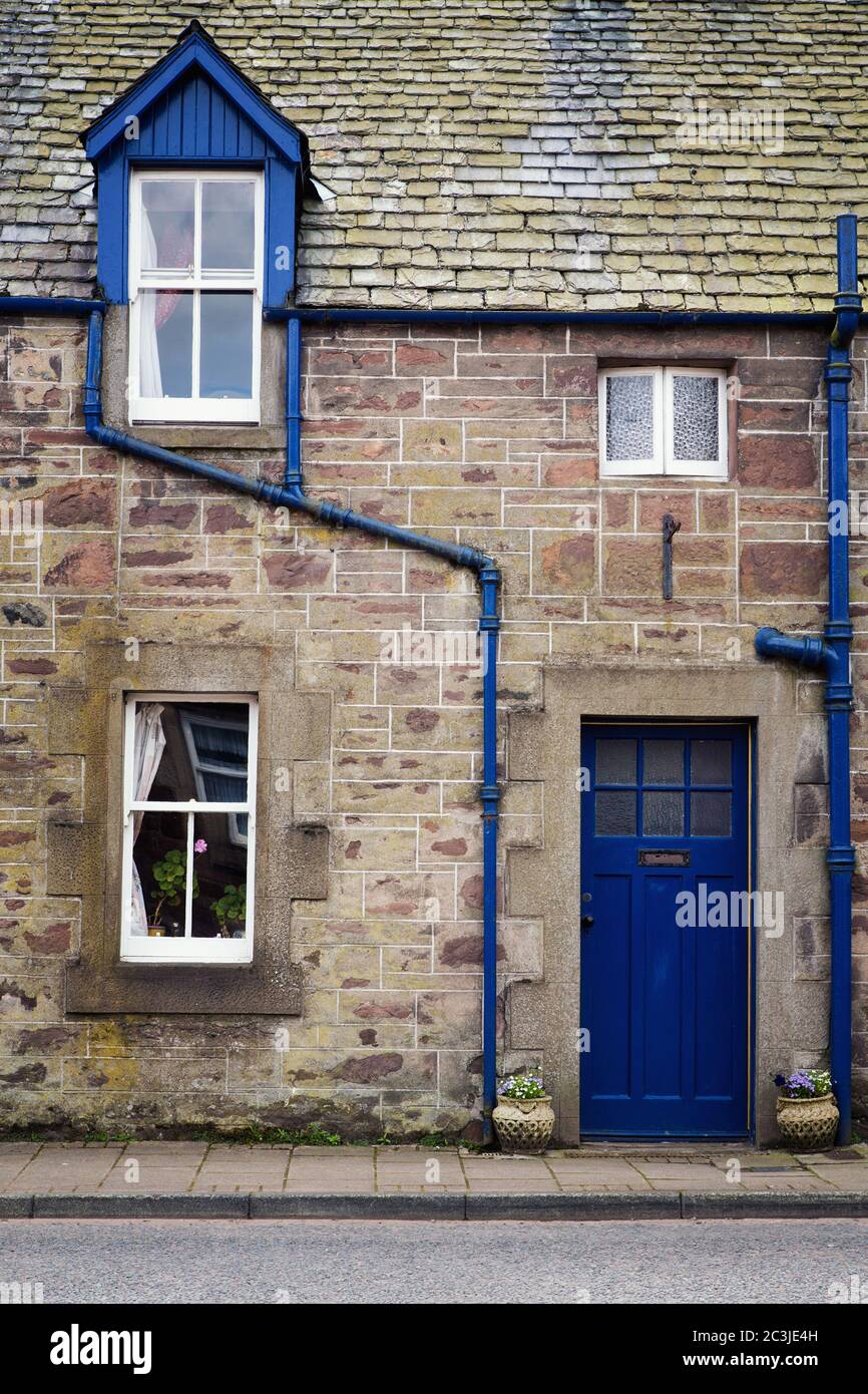 Rural cottage detail. Old stone cottage with blue window and door Stock ...