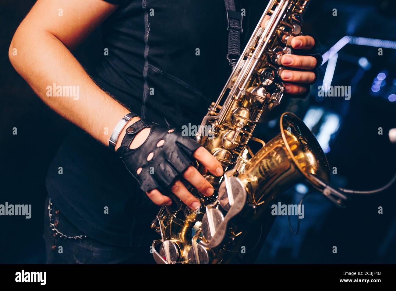 Boys Band saxophone section at event , jazz player male playing on Saxophone, music instrument played by man saxophonist  musician at  folk classical Stock Photo