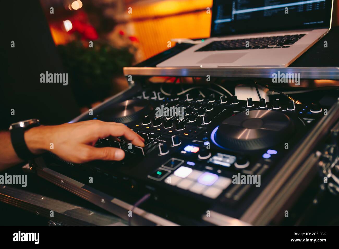 Overhead shot of Dj controling red party dj audio equipment.Turntable