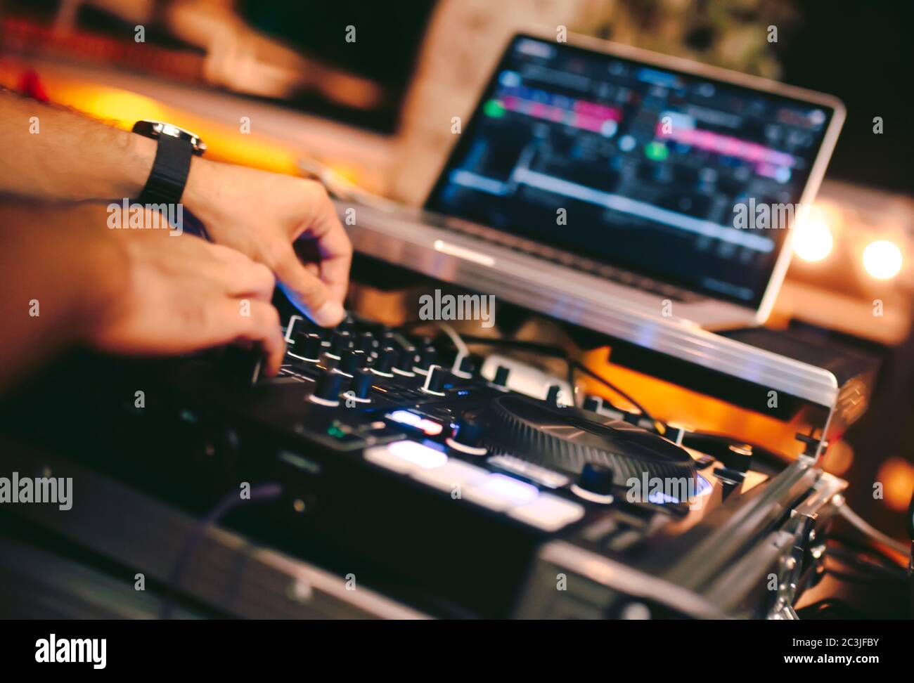 Overhead shot of Dj controling red party dj audio equipment.Turntable