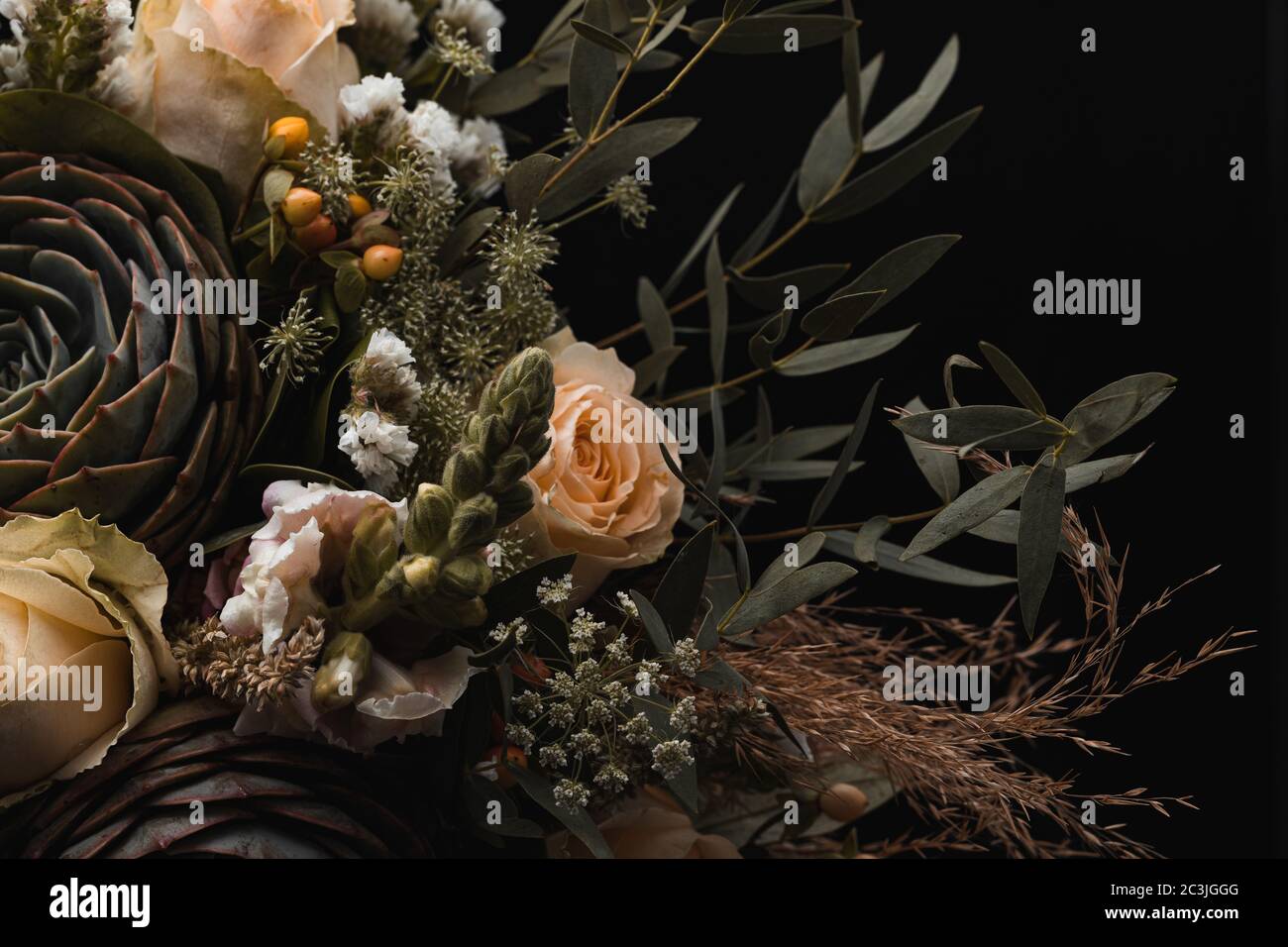 Closeup shot of a luxurious bouquet of orange and brown roses on a ...
