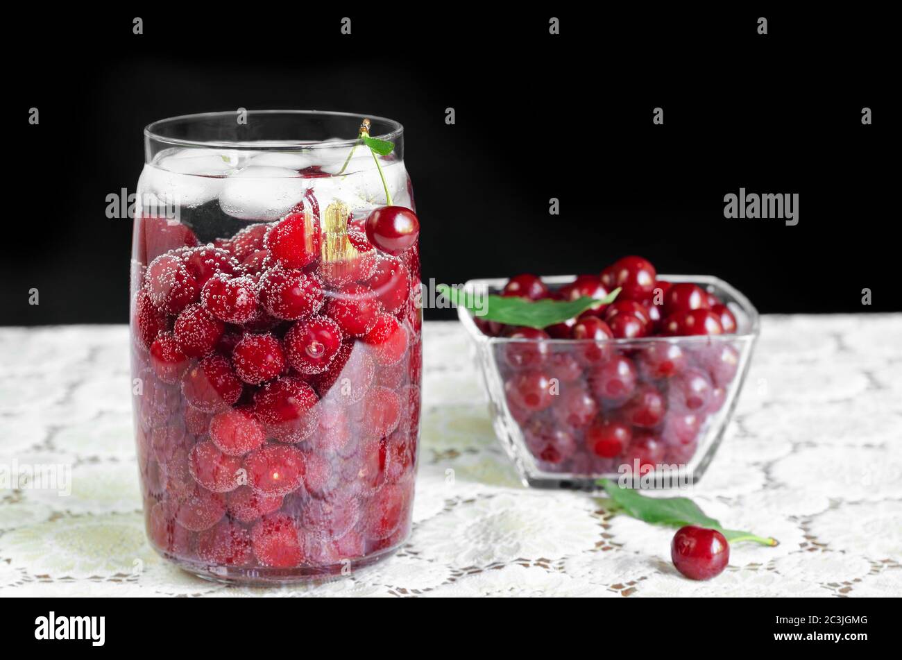 Cherry drink with ice in a jar Stock Photo