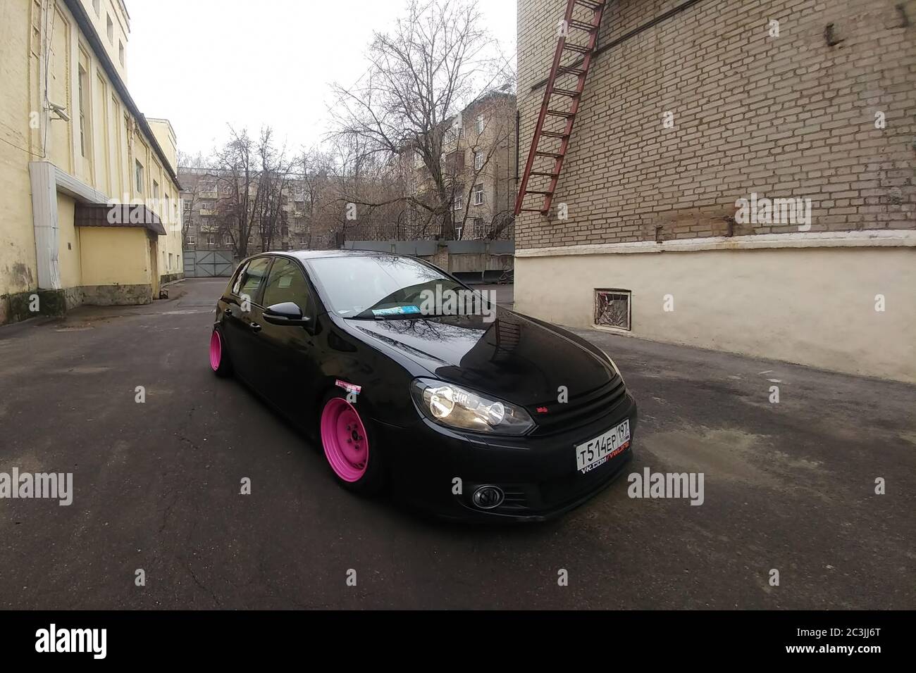 Moscow, Russia - May 08, 2019: A black tuned and understated Volkswagen Golf  6 with bright pink handmade custom wheels stands on the street. Low car  with air suspension installed Stock Photo - Alamy