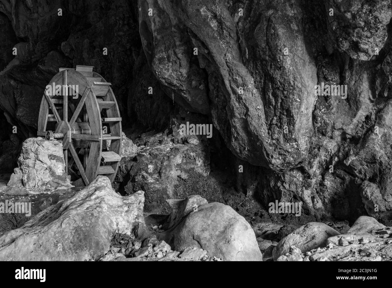 October 6, 2019 - Bellegra, Rome, Lazio, Italy - The karst caves, called 'Grotte dell'Arco' (Caves of the Arc). The wheel of an old mill, now in disus Stock Photo