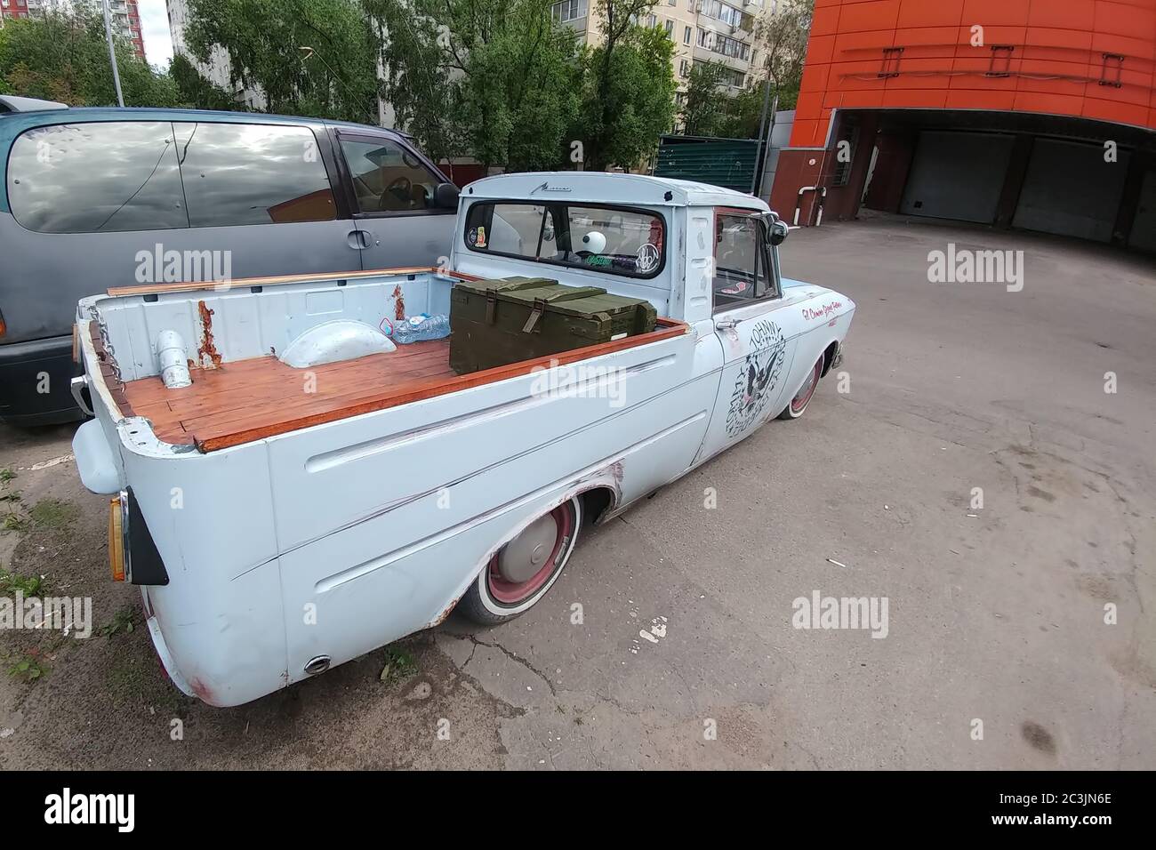 Moscow, Russia - May 03, 2019: IZH 2715. Retro custom car. Russian classic Pickup, reconstructed and tuned by low suspension. back side view. Wooden floor Stock Photo