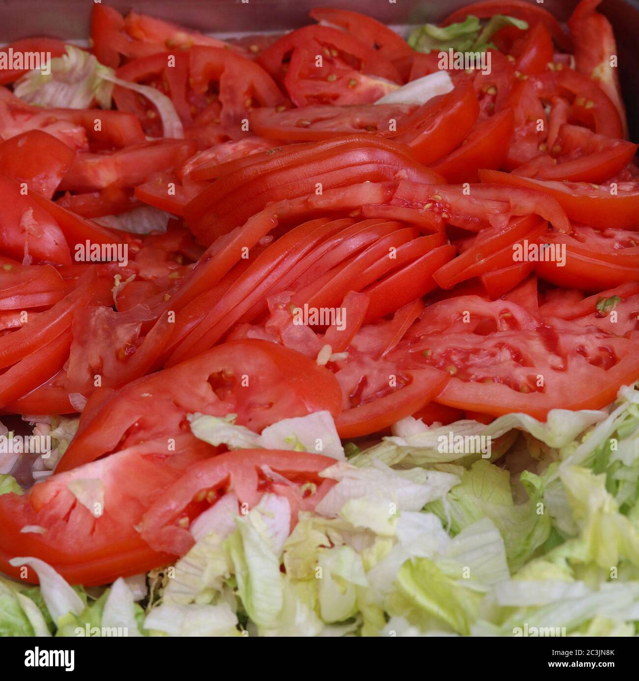 Slices of tomato and lettuce for sandwich, burger and salad fixings Stock  Photo - Alamy