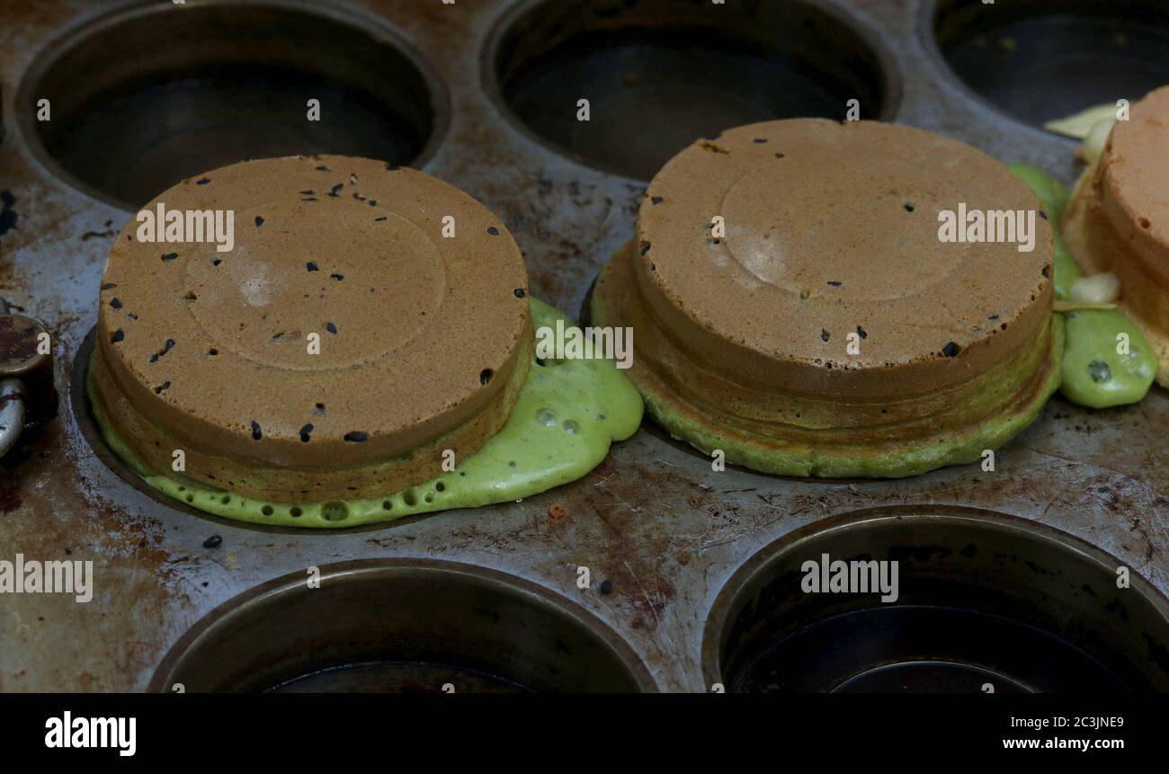 Chocolate chip mousse cake with chocolate mint ice cream in a muffin pan Stock Photo