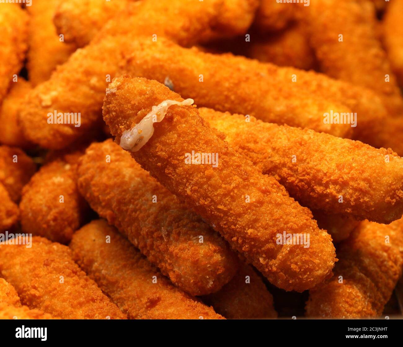 Golden fried mozzarella sticks at a street fair Stock Photo