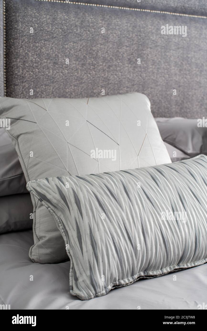 Decorative pillows on a bed Stock Photo