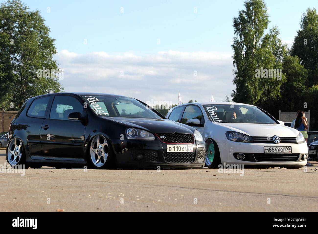 Moscow. Russia - May 20, 2019: Black Volkswagen Golf mk 5 and white mk 6 in tuning on air suspension, low and with wide wheels. They are parked on the street. Stock Photo