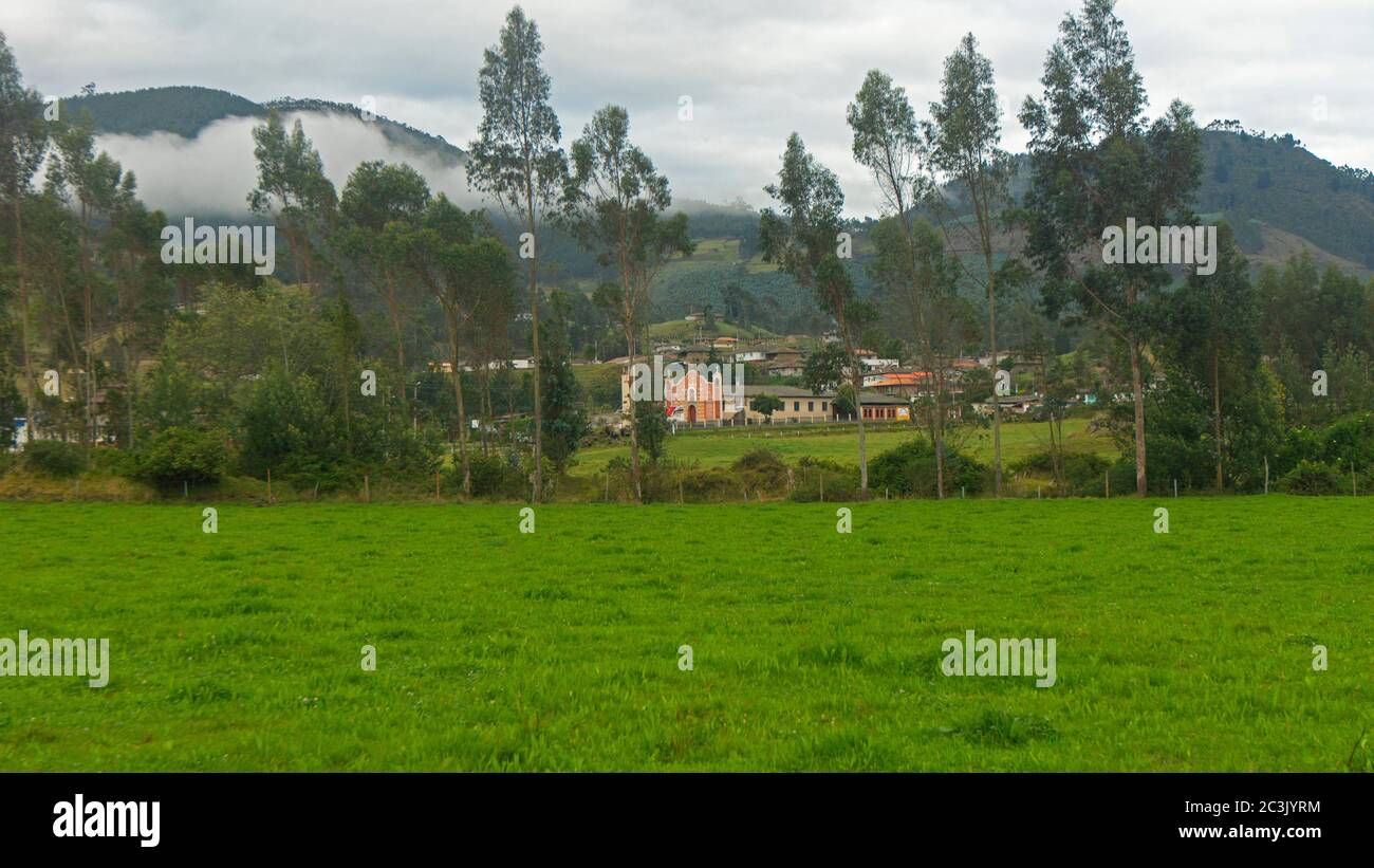 Zuleta, Imbabura / Ecuador - November 9 2018: View of the village of Zuleta with background of mountains with trees on a cloudy day from a field with Stock Photo