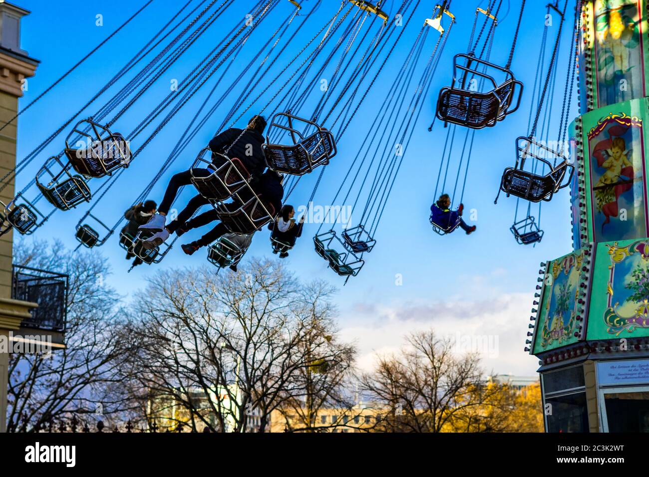 Low angle picture of carousel in motion at the amusement park in Vienna ...