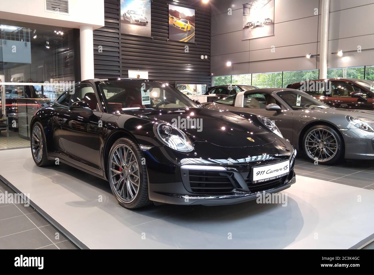 Moscow. February 2019. Black Porsche 911 Carrera 4S 991 in showroom of  dealership Stock Photo - Alamy