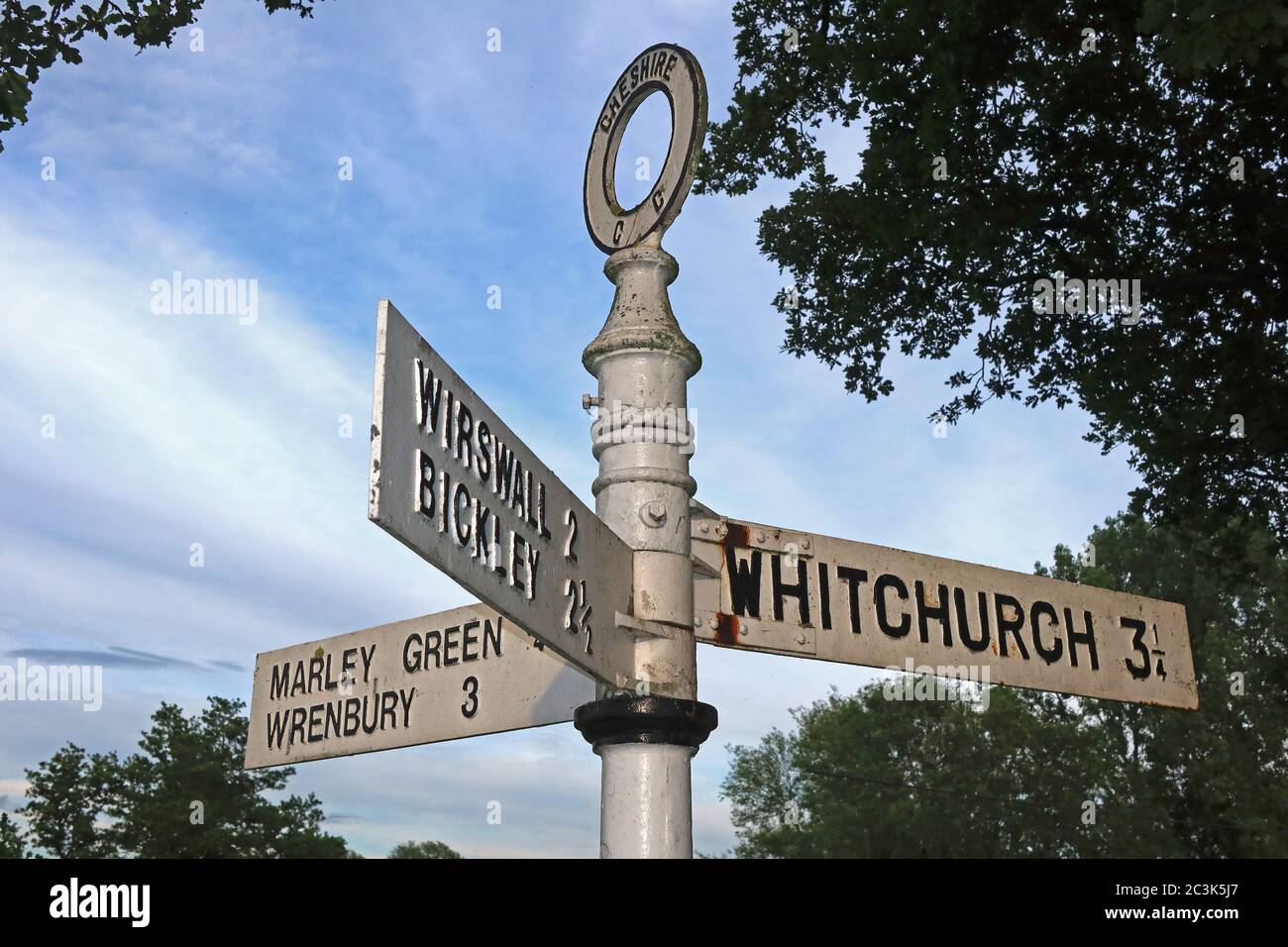 White Cheshire CC Fingerpost sign,Marbury Village,Cheshire, England,UK, SY13 - Whitchurch,Wirswall,Bickley,Marley Green,Wrenbury Stock Photo