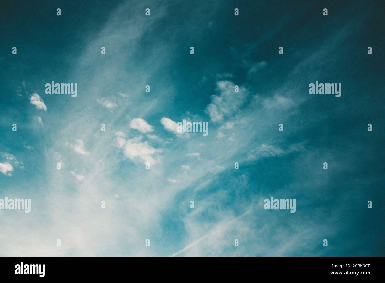 Low angle shot of the breathtaking fluffy clouds in the blue sky Stock ...