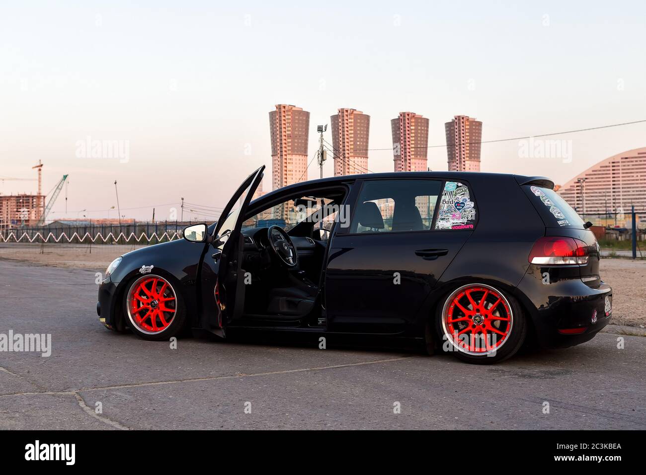Moscow. Autumn 2018. Black Volkswagen Golf tuning. Air suspension, orange  wide wheels and polish rims. Lowrider. Stance style. On asphalt with open  door Stock Photo - Alamy